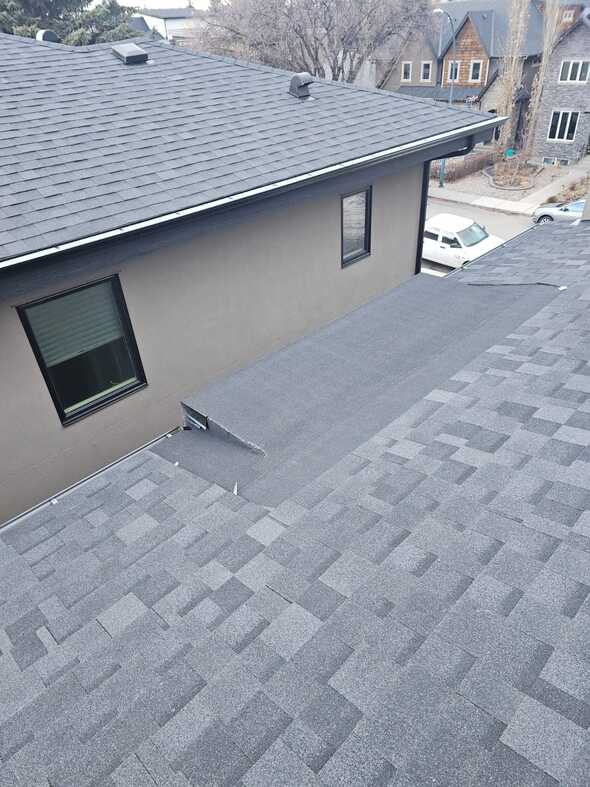 flat roof over cantilever section efficient snow shedding