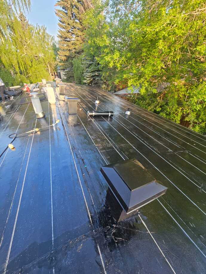 two ply flat torch down roofing system upgraded attic ventilation for low pitch residential roof