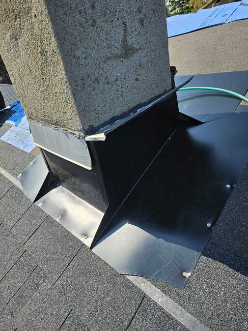 new black chimney reflashing to stop leak calgary ab