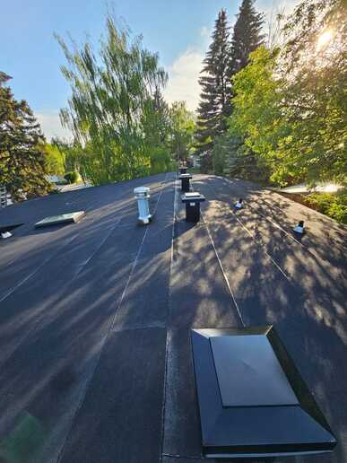 new flat roof installation upgraded ventilation system