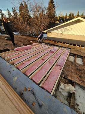 replacing damaged attic insulation to low pitch roof