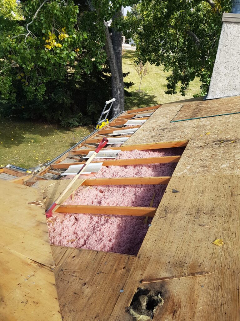 replacing damaged sheathing caused metal valley leak and replacing attic insulation