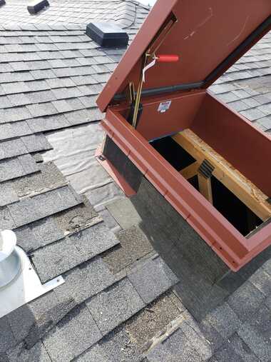 replacing shingles and adding ice water barrier to red roof hatch access