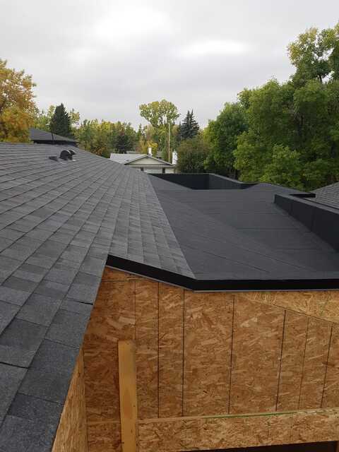 shingles flat roof combination cricket to divert water