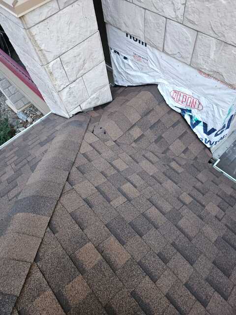 waterproofing and flashing cricket area to chimney before shingling
